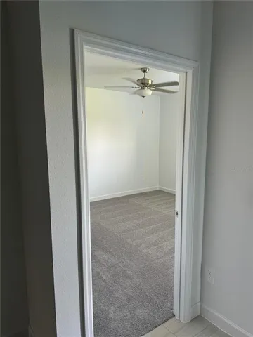 a view of a refrigerator and window in a room