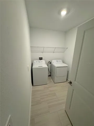 a spacious bathroom with a double vanity sink and mirror
