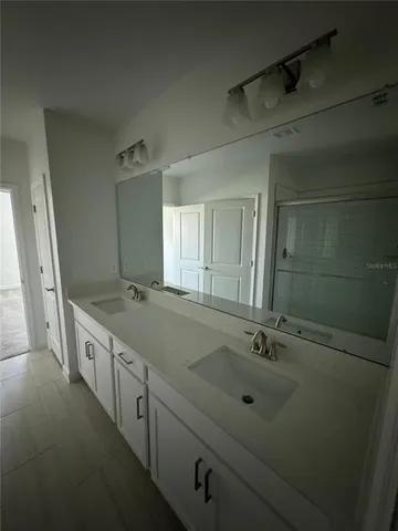 a bathroom with a sink and toilet