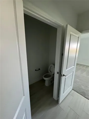 a bathroom with a glass door shower