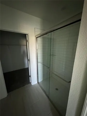 a bathroom with a double vanity sink and mirror