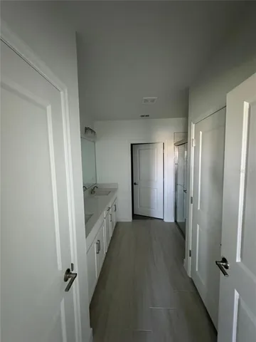 a view of a bathroom with a tub sink and mirror