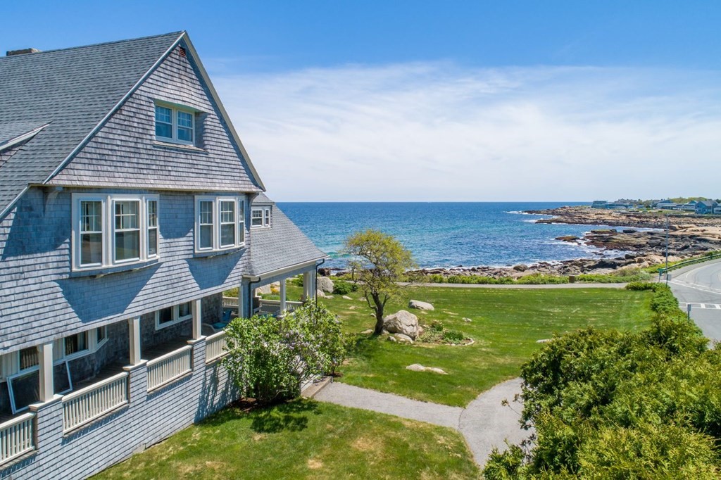 a aerial view of a house with a yard