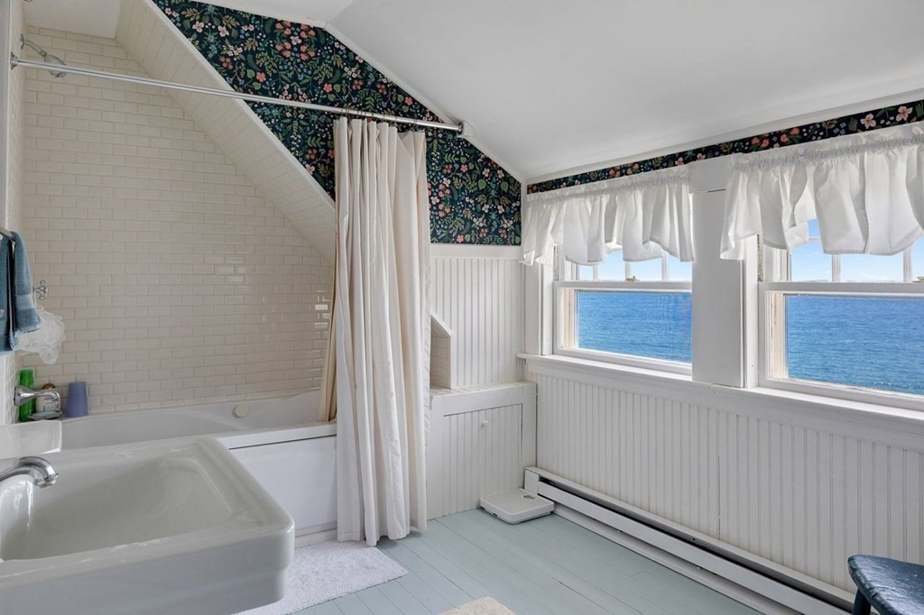 7 Bass Rocks Road Gloucester, MA 01930 - Photo 18 of 36 a bathroom with a bathtub and a shower
