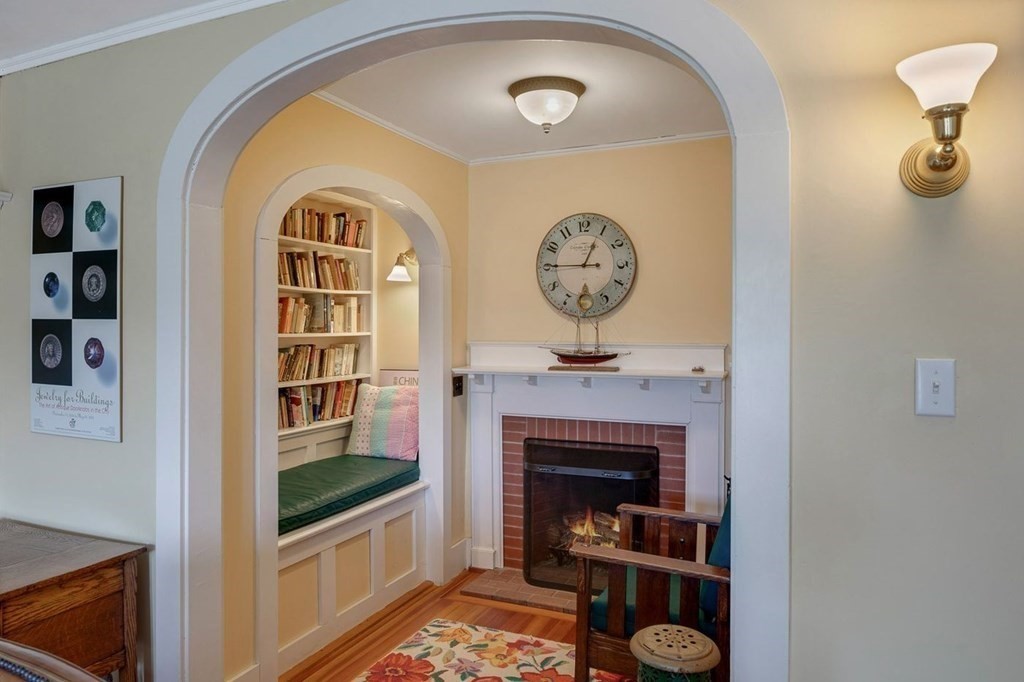 7 Bass Rocks Road Gloucester, MA 01930 - Photo 22 of 36 a living room with furniture and a fireplace