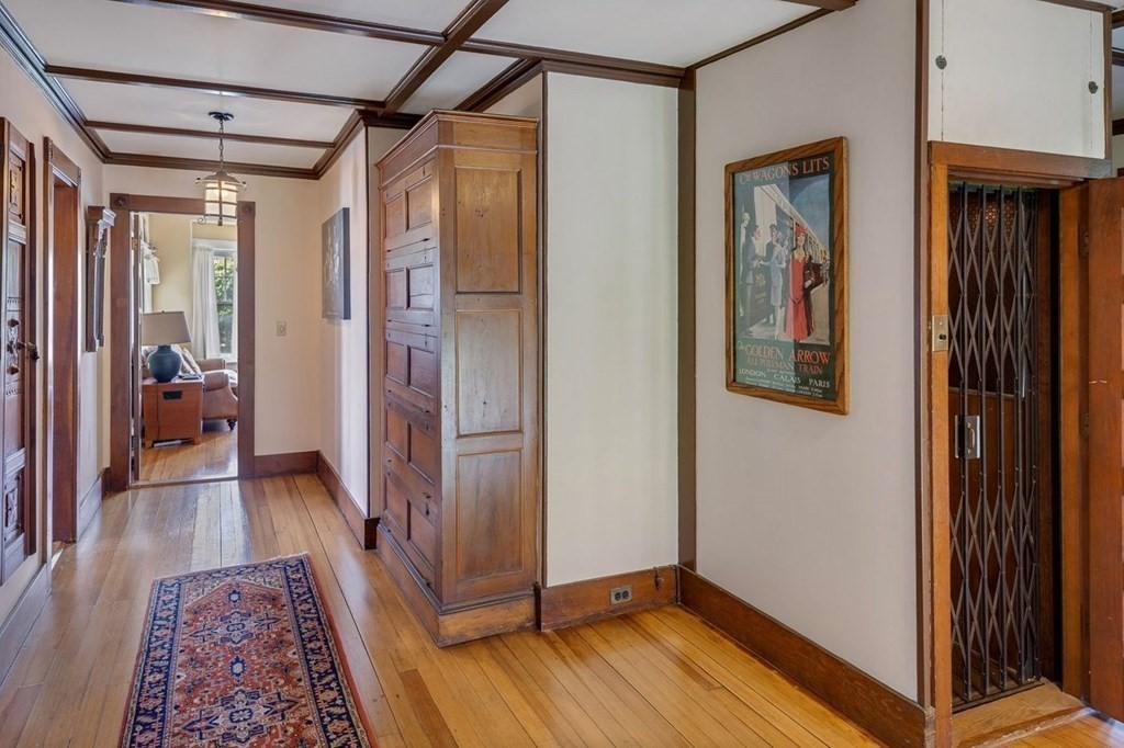 7 Bass Rocks Road Gloucester, MA 01930 - Photo 23 of 36 a view of a hallway with wooden floor and closet