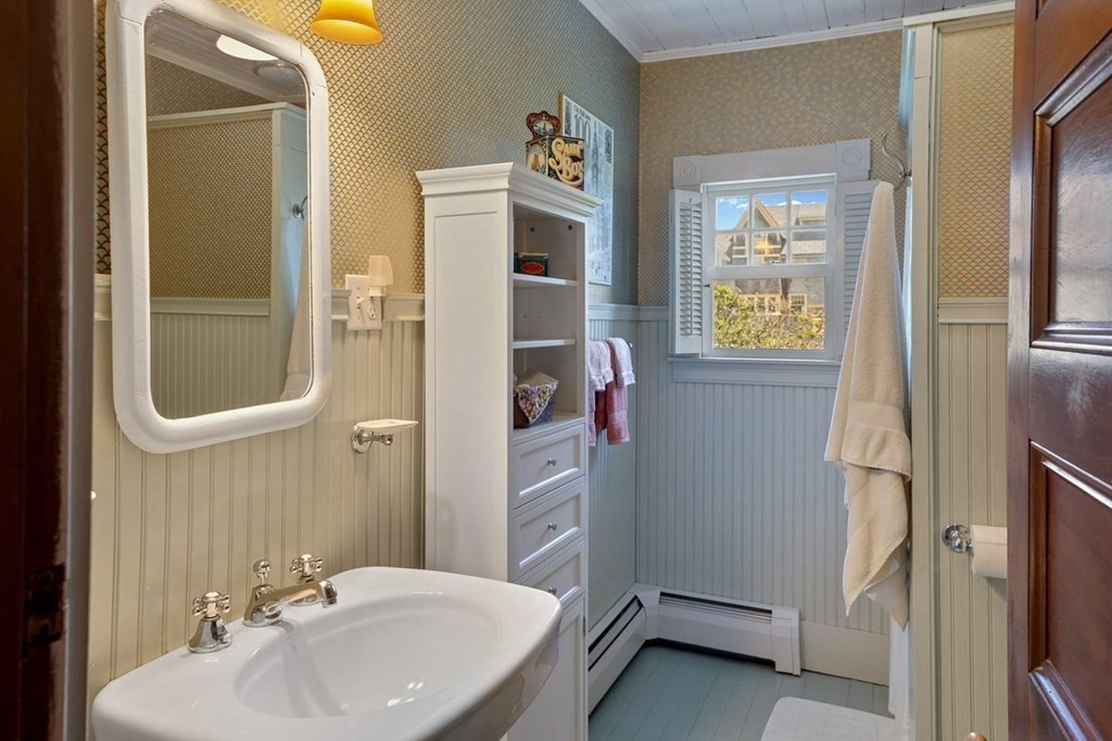 7 Bass Rocks Road Gloucester, MA 01930 - Photo 25 of 36 a bathroom with a sink and a mirror