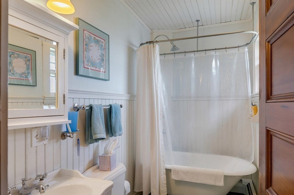 7 Bass Rocks Road Gloucester, MA 01930 - Photo 27 of 36 a bathroom with a shower curtain and a sink