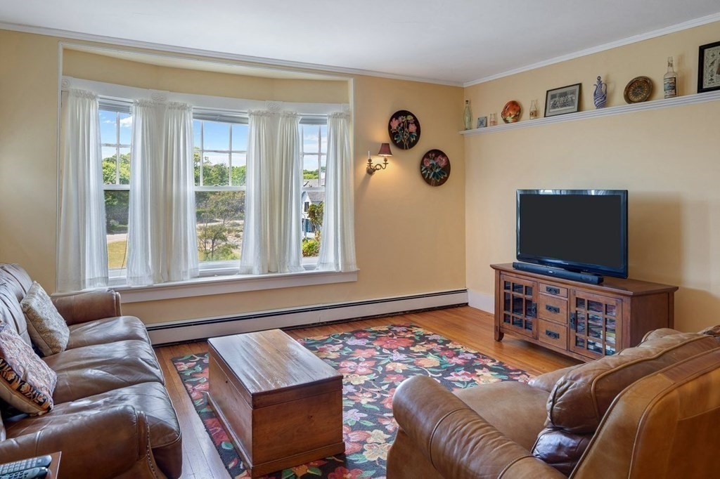 7 Bass Rocks Road Gloucester, MA 01930 - Photo 29 of 36 a bedroom with a bed and flat screen tv