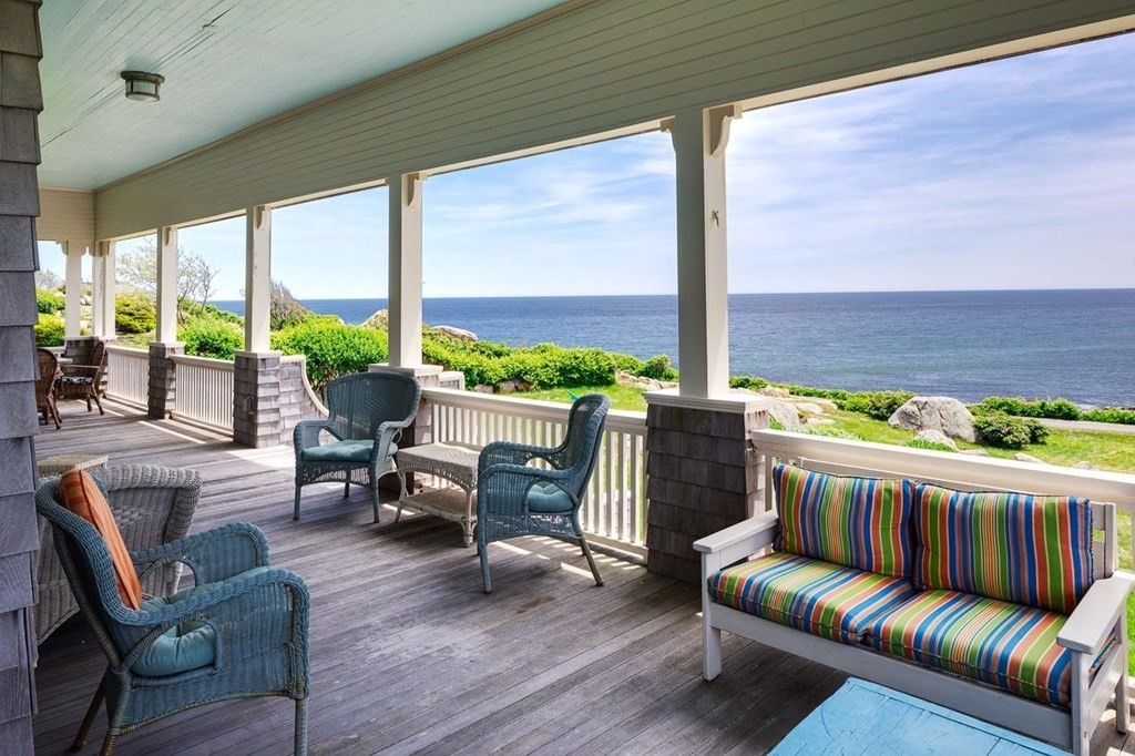 7 Bass Rocks Road Gloucester, MA 01930 - Photo 3 of 36 a living room with furniture and a large window