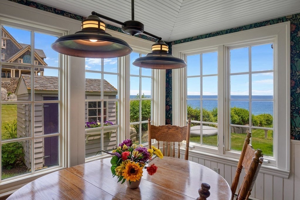 7 Bass Rocks Road Gloucester, MA 01930 - Photo 6 of 36 a view of a dining room with furniture wooden floor and chandelier