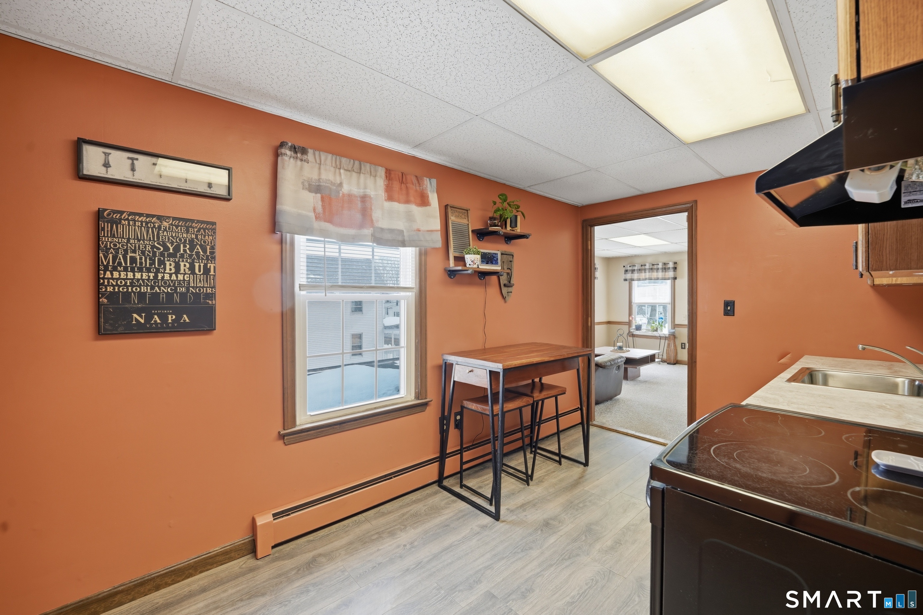 66 Maple Avenue Windsor, CT 06095 - Photo 11 of 38 a living room with furniture and a window