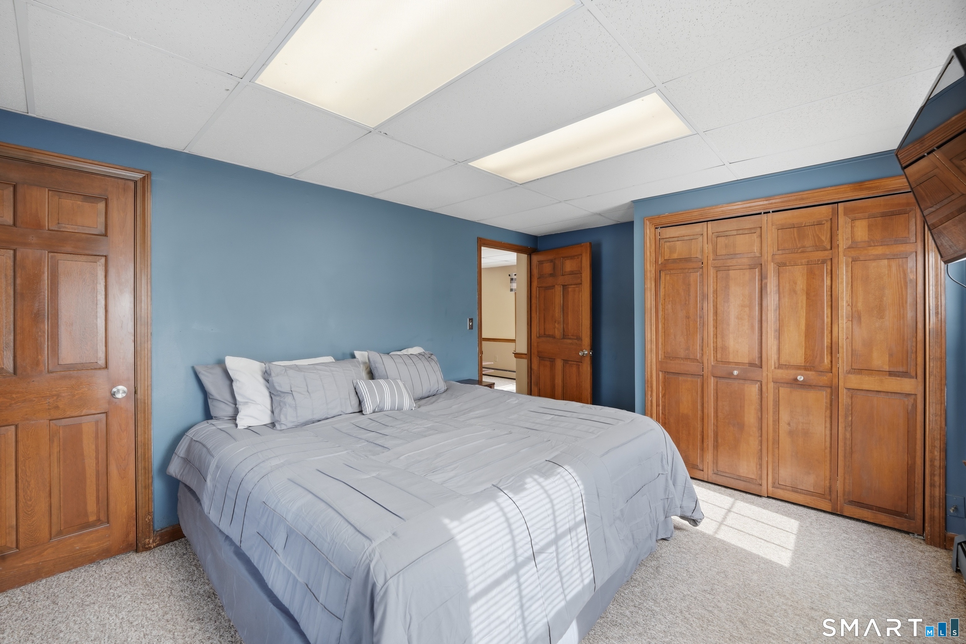 66 Maple Avenue Windsor, CT 06095 - Photo 14 of 38 a bedroom with a large bed and a window