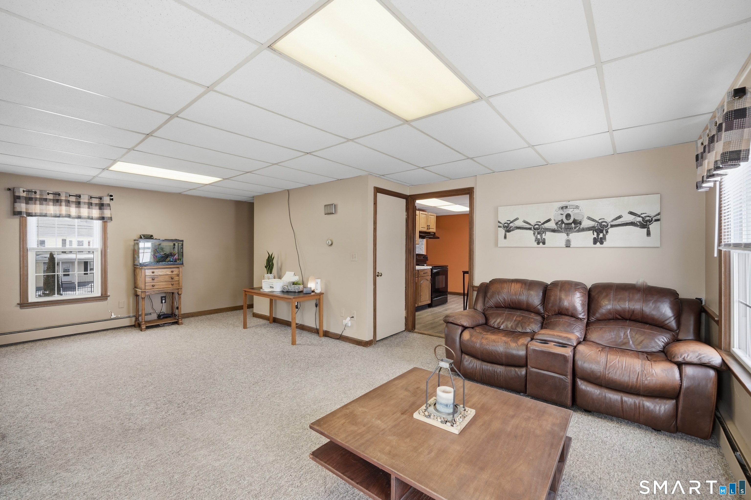 66 Maple Avenue Windsor, CT 06095 - Photo 15 of 38 a living room with furniture and a window
