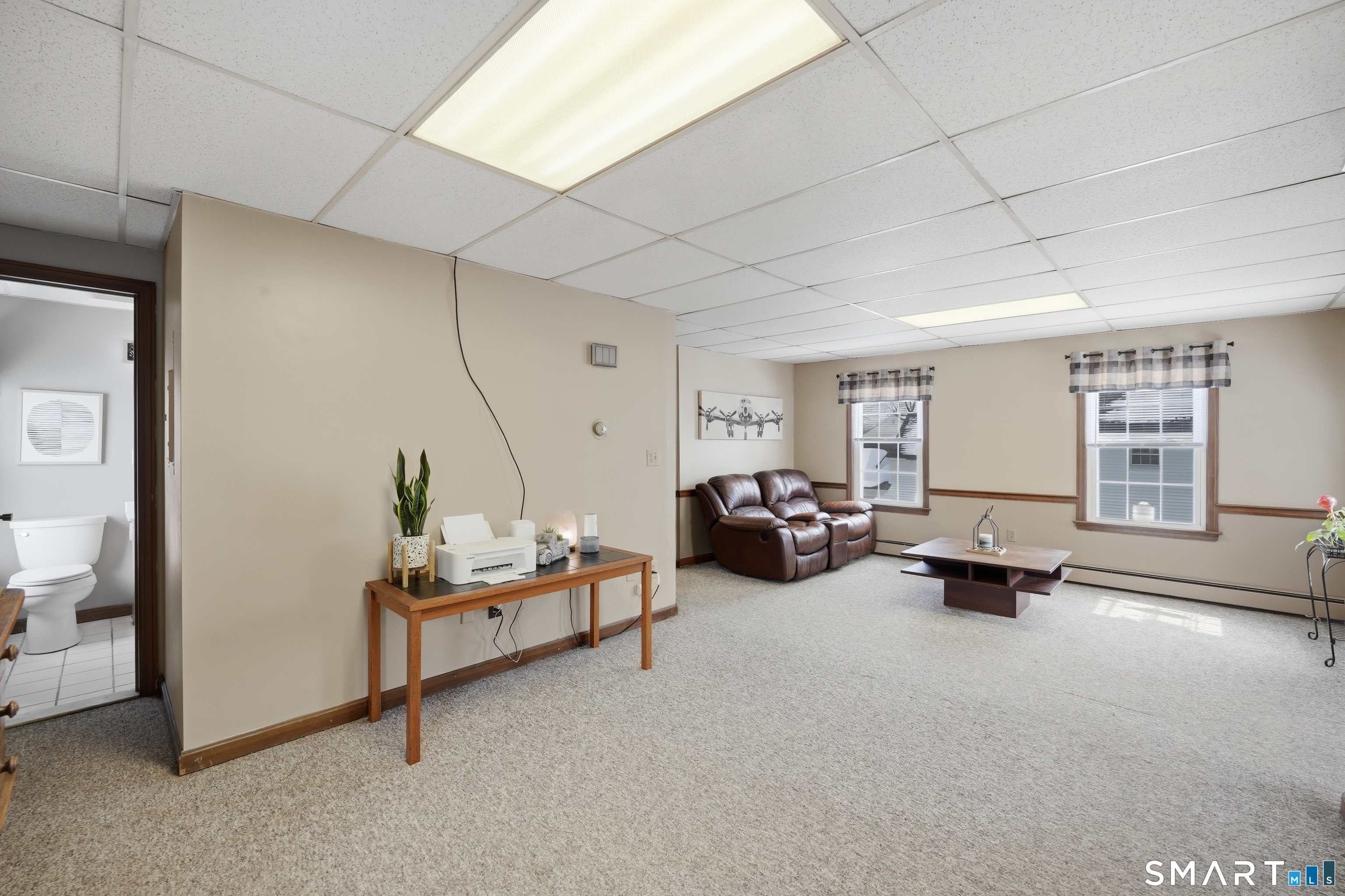 66 Maple Avenue Windsor, CT 06095 - Photo 17 of 38 a bedroom with furniture and a window