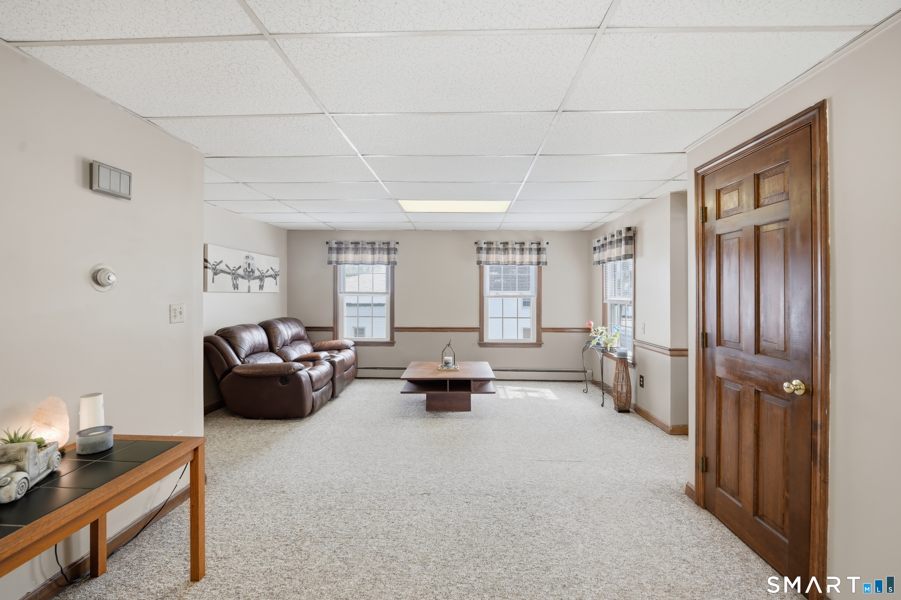 66 Maple Avenue Windsor, CT 06095 - Photo 18 of 38 a living room with furniture and a window