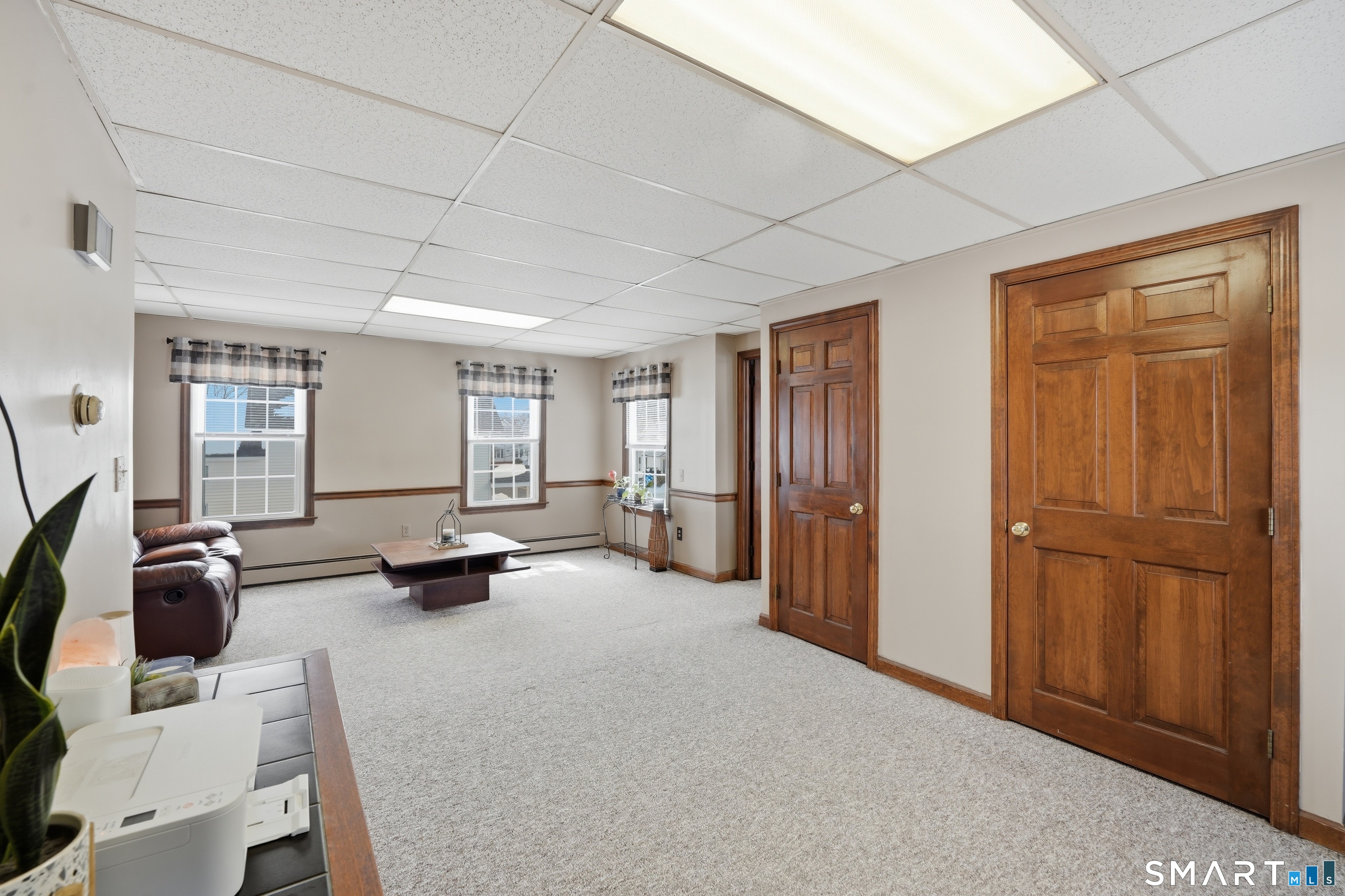 66 Maple Avenue Windsor, CT 06095 - Photo 19 of 38 a view of a livingroom with furniture and gym equipment
