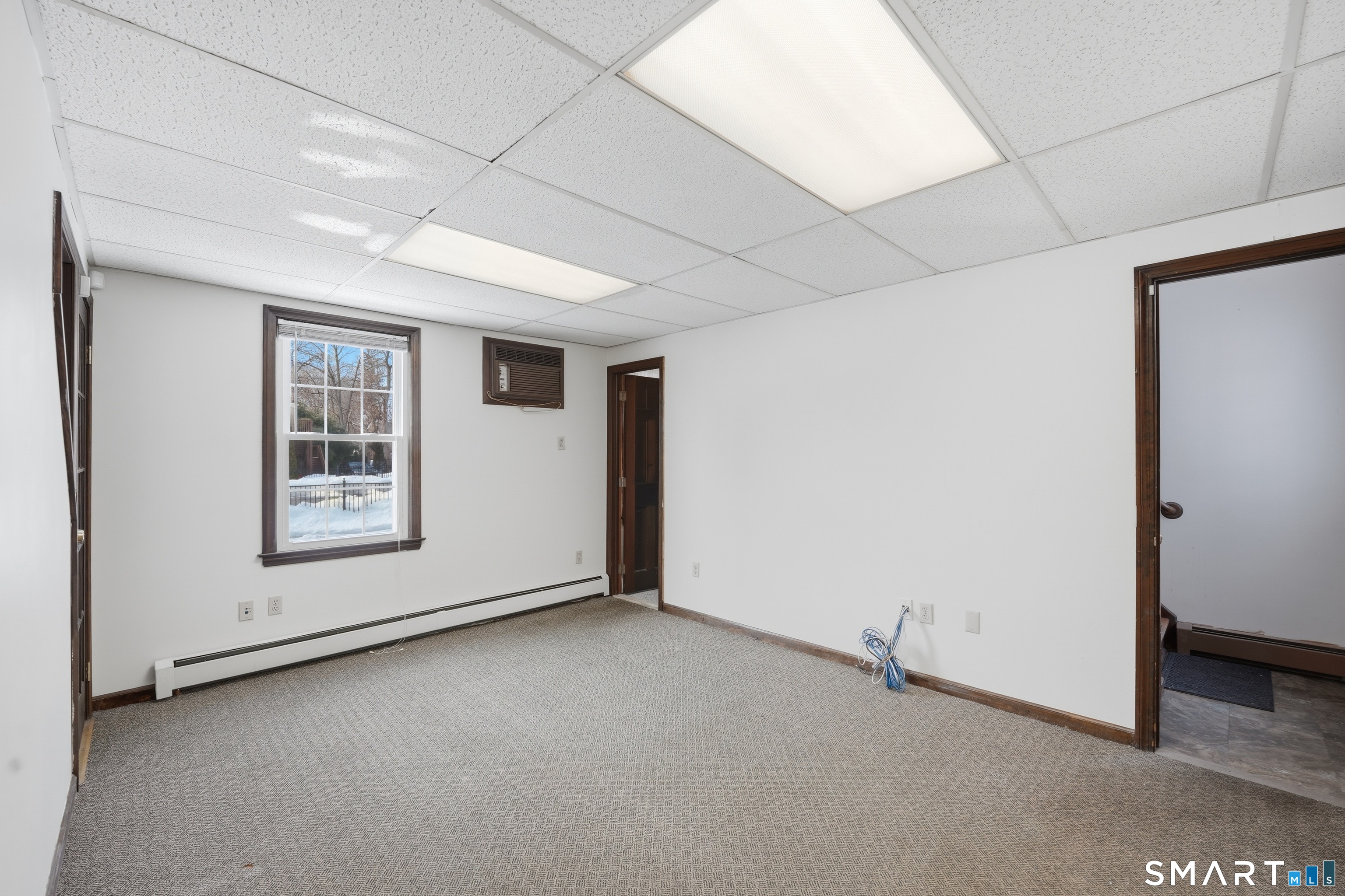 66 Maple Avenue Windsor, CT 06095 - Photo 24 of 38 a view of an empty room with a window