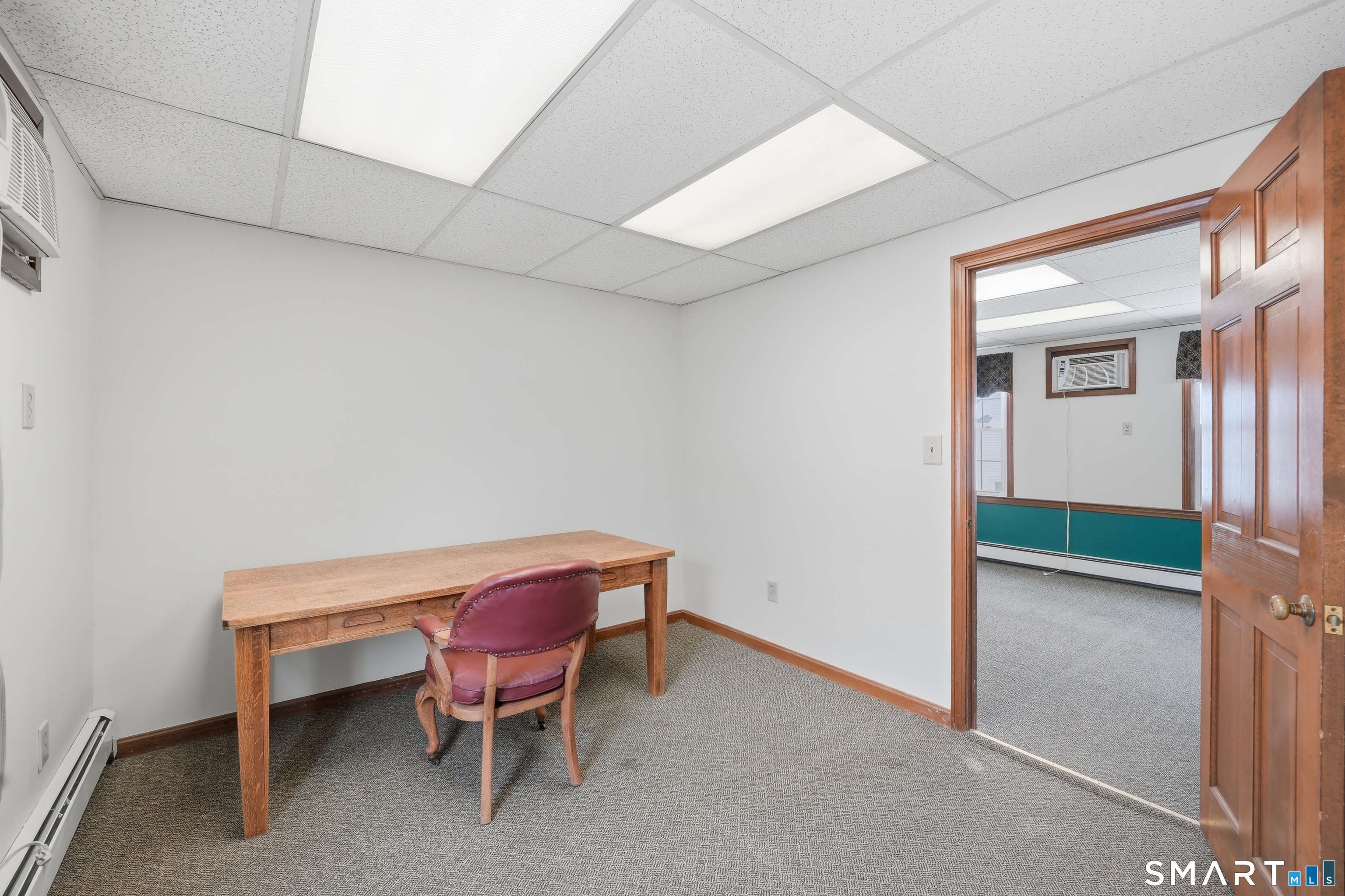 66 Maple Avenue Windsor, CT 06095 - Photo 26 of 38 a view of a room with a table and chairs