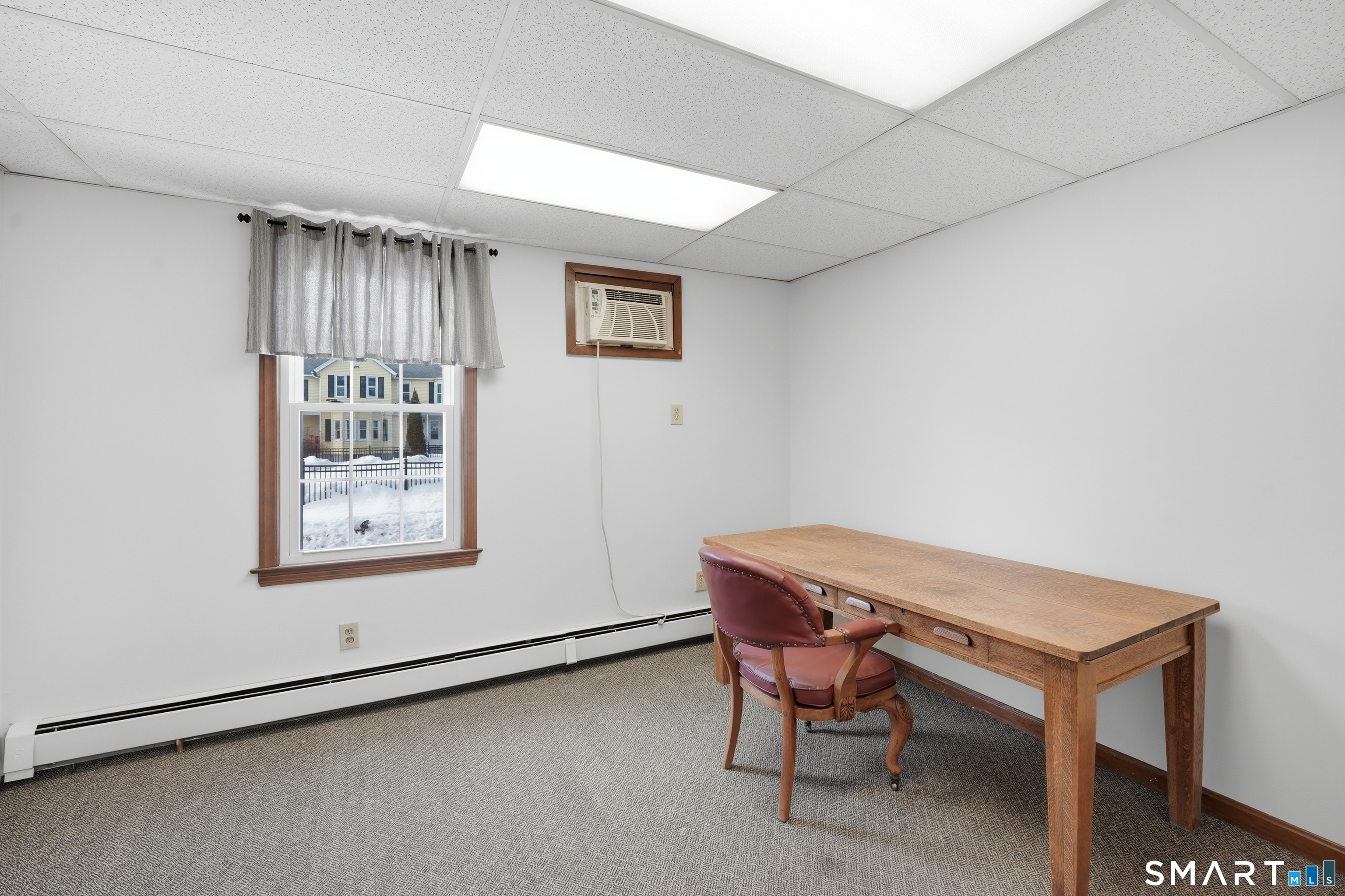 66 Maple Avenue Windsor, CT 06095 - Photo 36 of 38 a room with a table and chairs