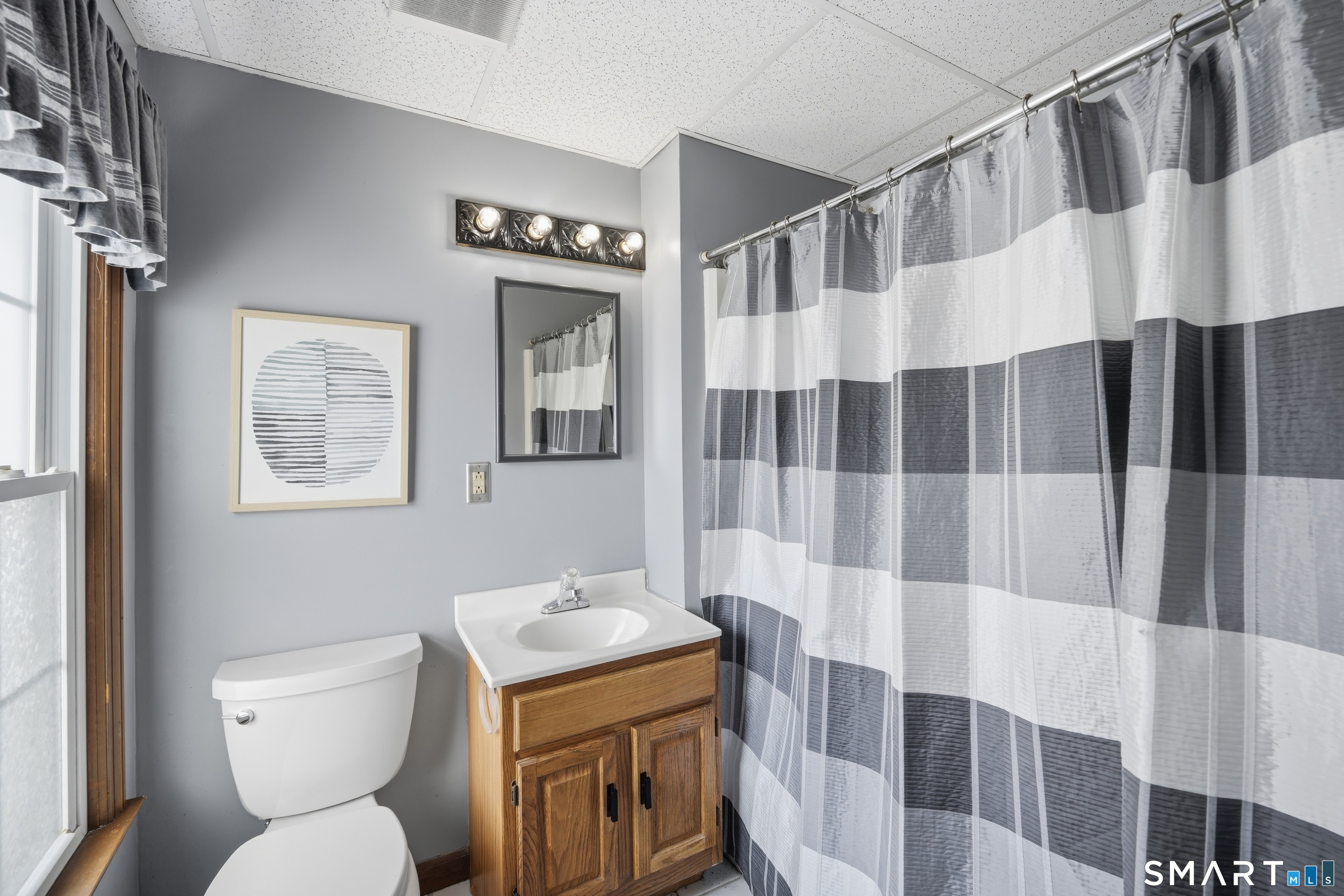 66 Maple Avenue Windsor, CT 06095 - Photo 37 of 38 a bathroom with a sink toilet and shower