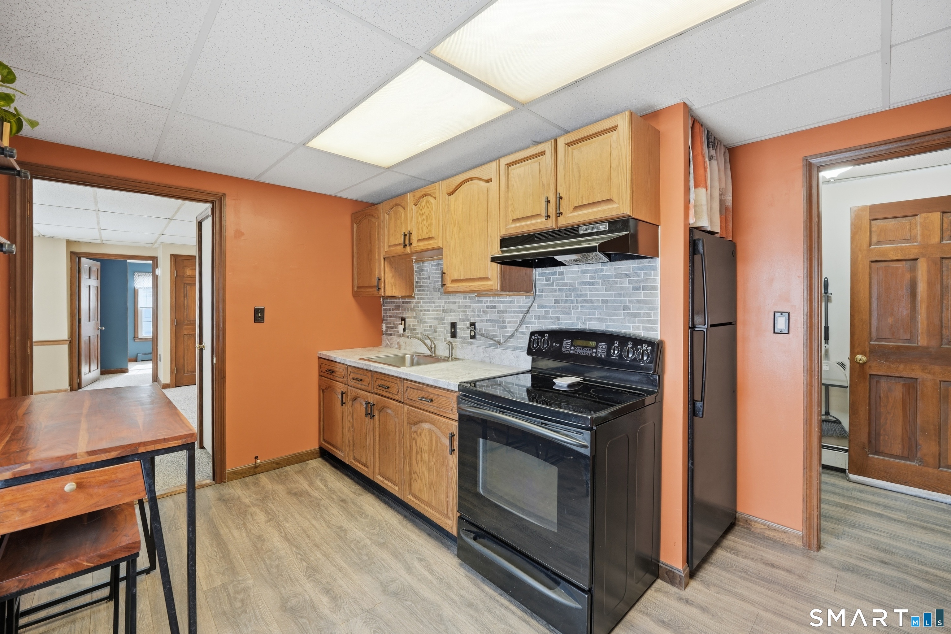 66 Maple Avenue Windsor, CT 06095 - Photo 10 of 38 a kitchen with stainless steel appliances granite countertop a stove and a refrigerator