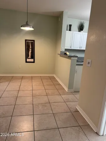 a view of a livingroom with wooden floor and a window