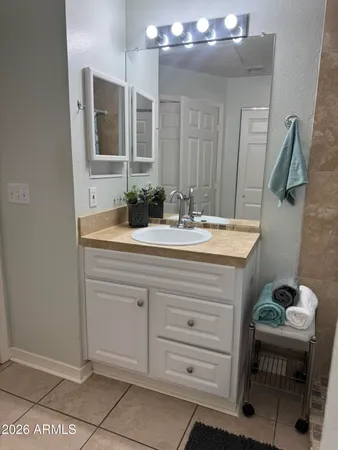 a bathroom with a sink and a mirror