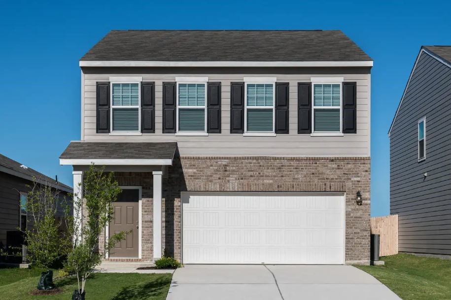 321 Enforcer Loop Jarrell, TX 76537 - Photo 1 of 1 a front view of a house with garden