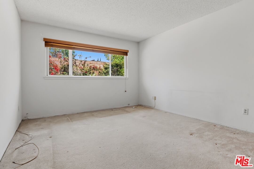 19131 Tulsa Street Porter Ranch, CA 91326 - Photo 19 of 43 an empty room with windows