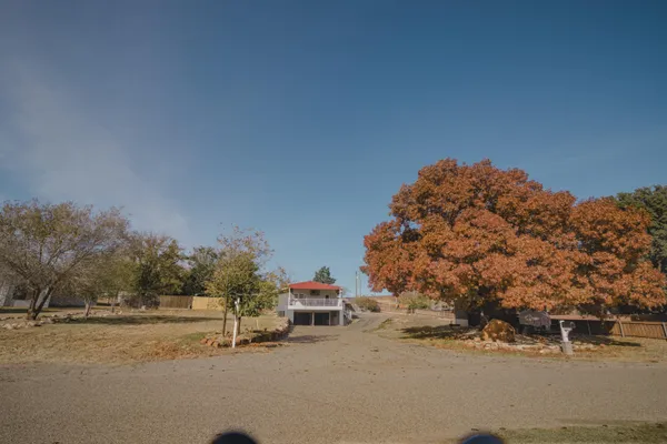 a view of a road with a building in the background