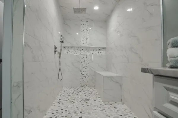 a bathroom with a sink mirror and vanity