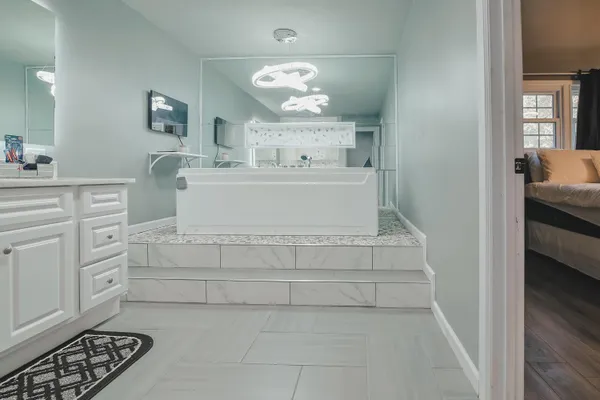 a bathroom with a glass door shower