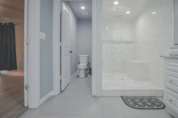 a view of a hallway with wooden floor