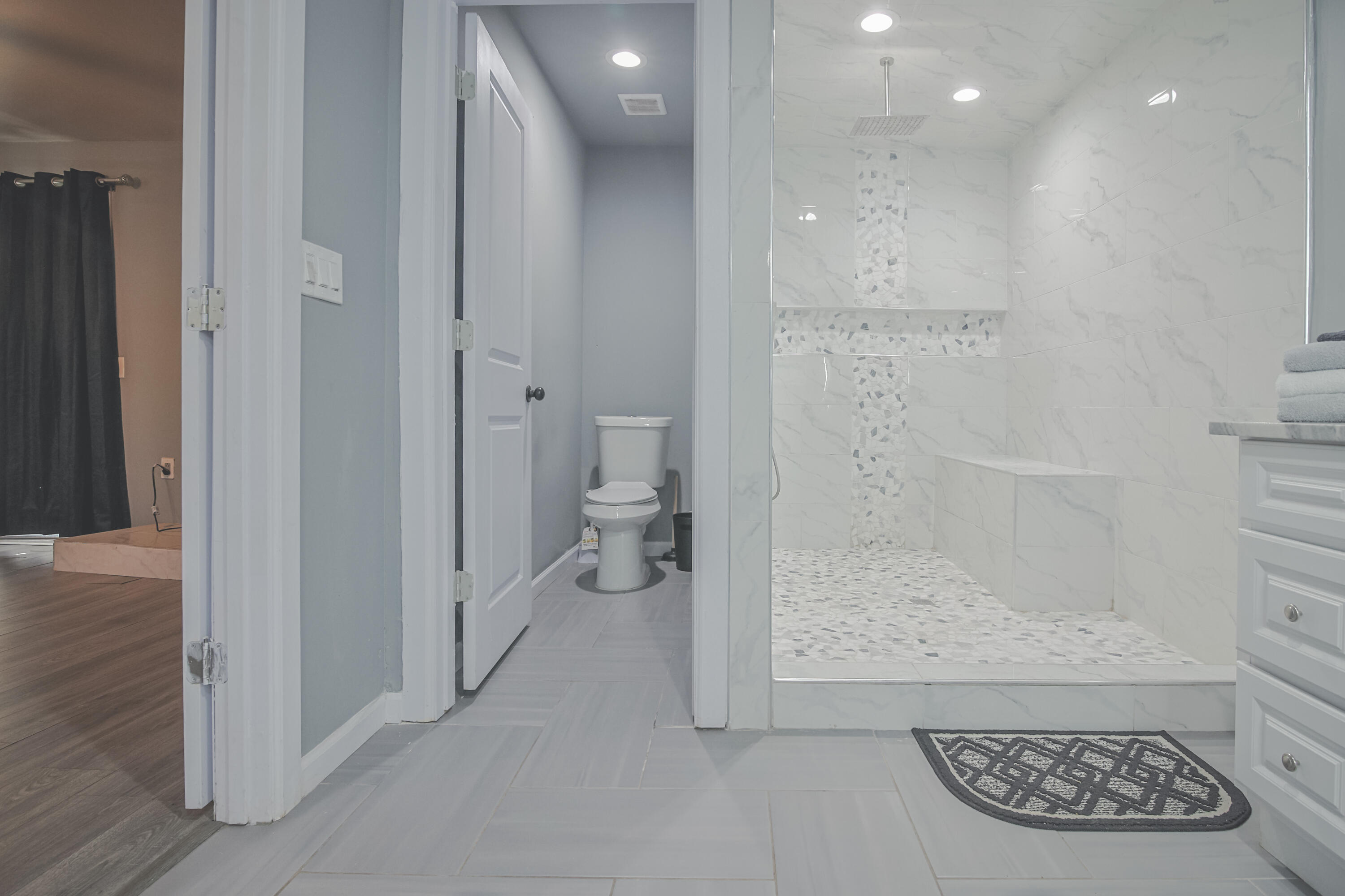 3407 Canyon Road Lubbock, TX 79403 - Photo 23 of 37 a bathroom with a glass door shower