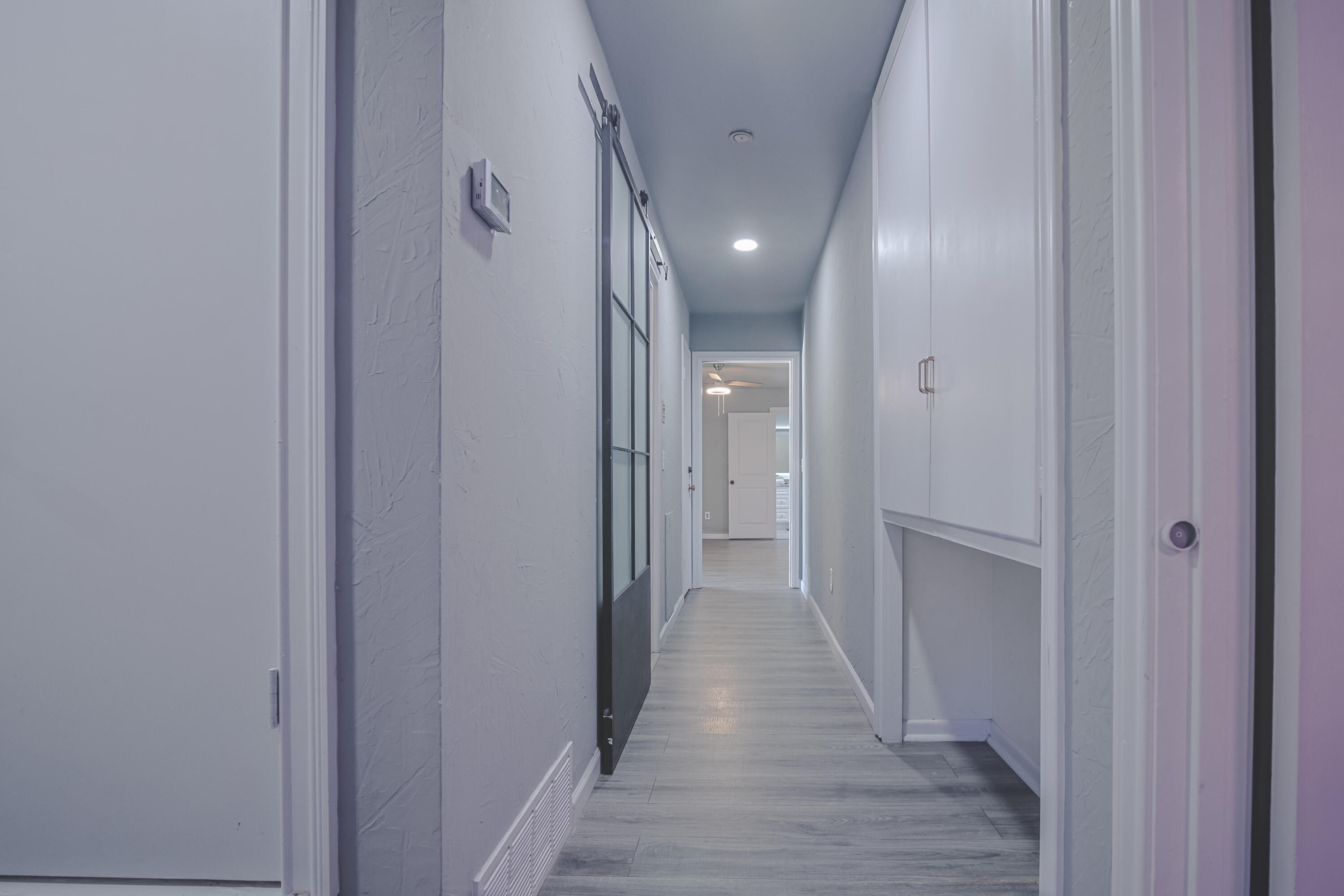 3407 Canyon Road Lubbock, TX 79403 - Photo 24 of 37 a view of a hallway with wooden floor