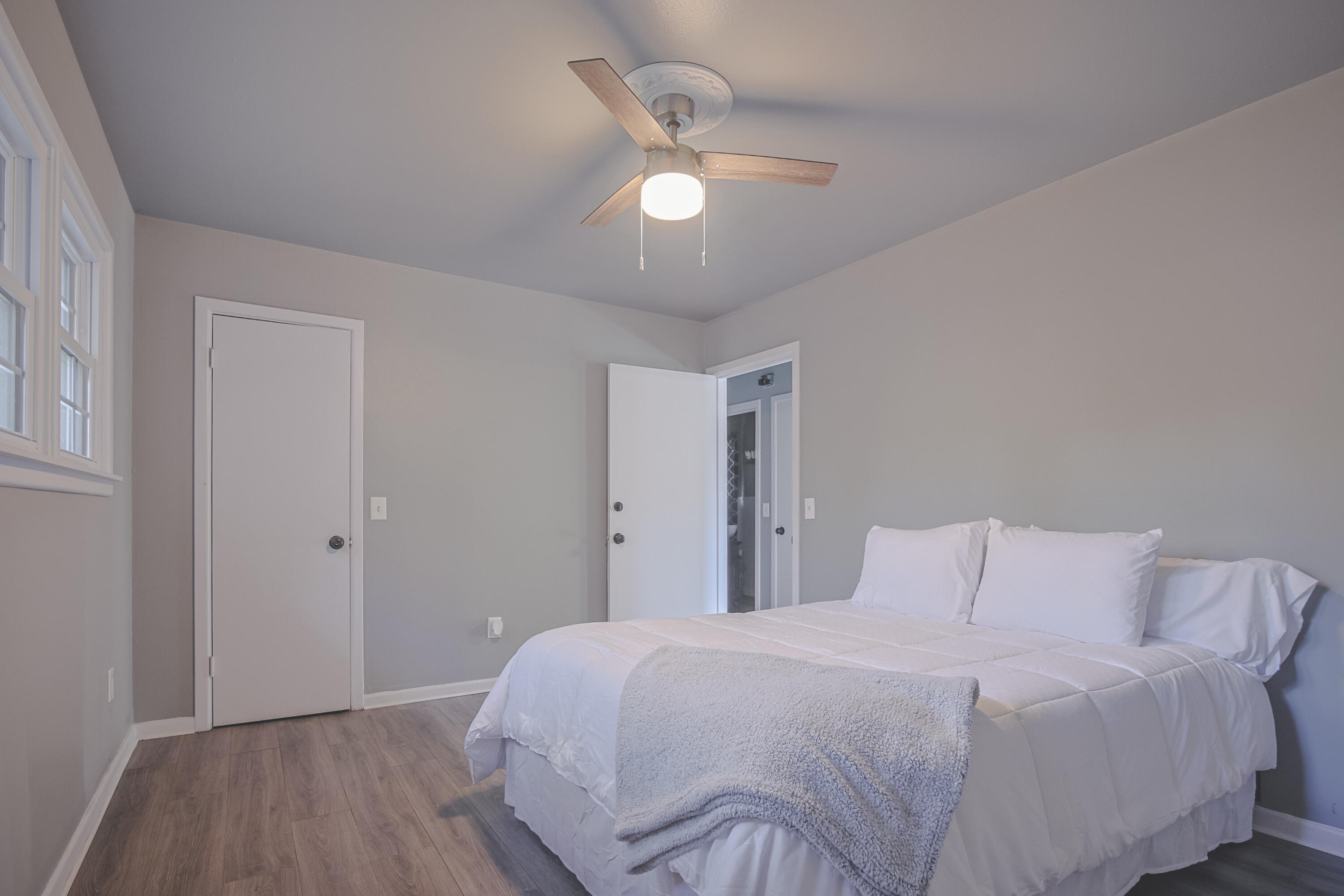 3407 Canyon Road Lubbock, TX 79403 - Photo 27 of 37 a bedroom with a bed and a lamp