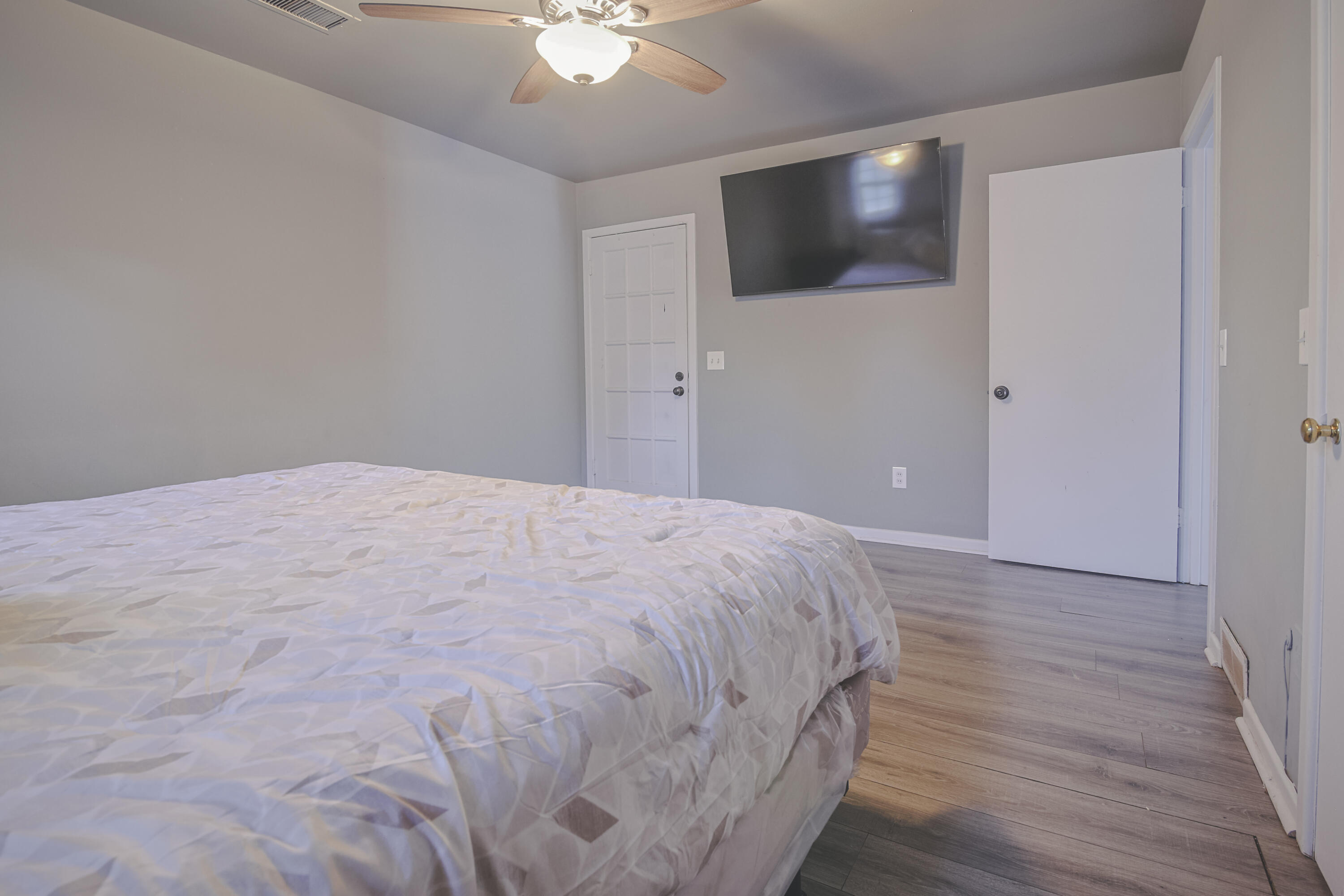 3407 Canyon Road Lubbock, TX 79403 - Photo 31 of 37 a bedroom with a bed and a flat screen tv
