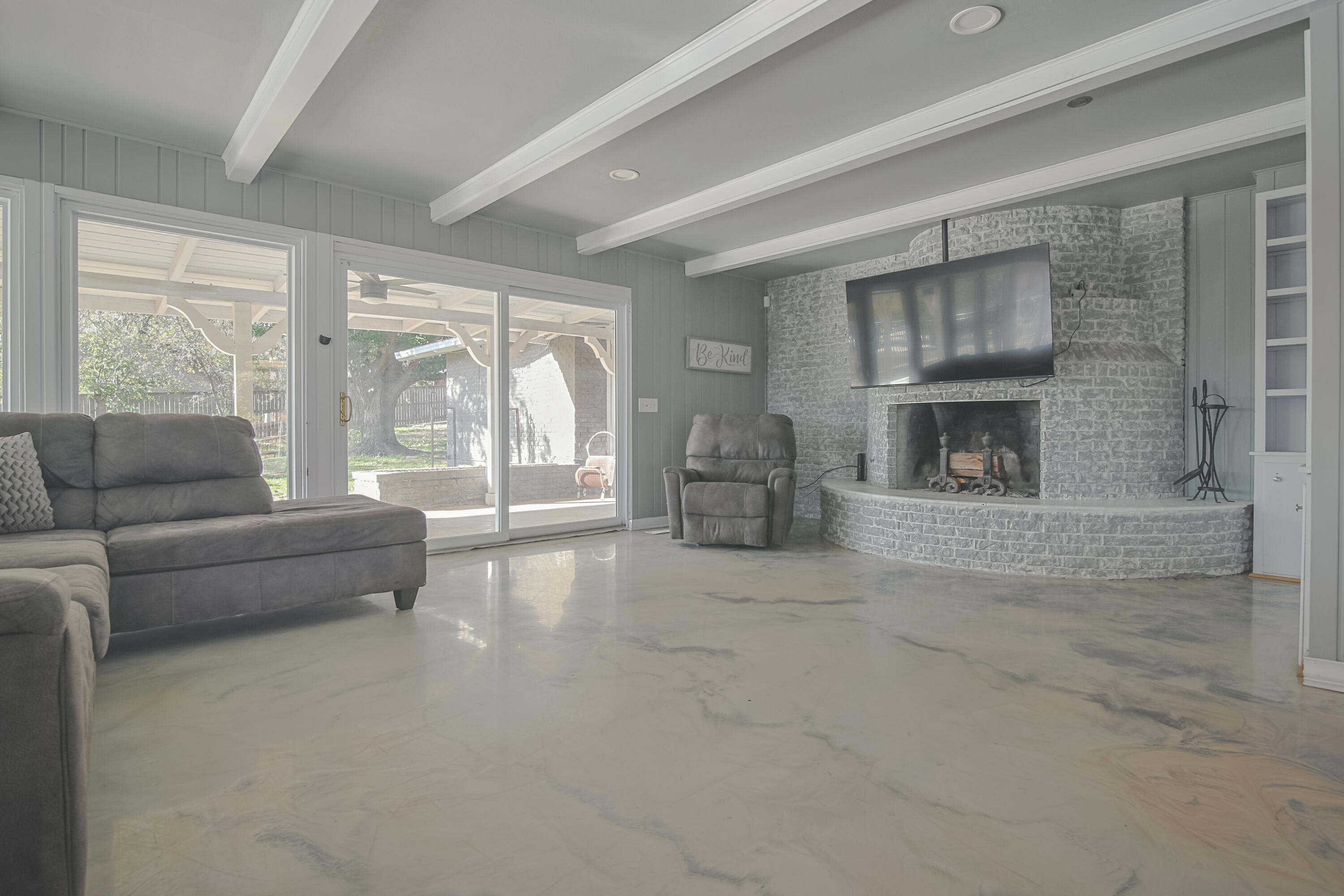 3407 Canyon Road Lubbock, TX 79403 - Photo 4 of 37 a living room with furniture and a fireplace