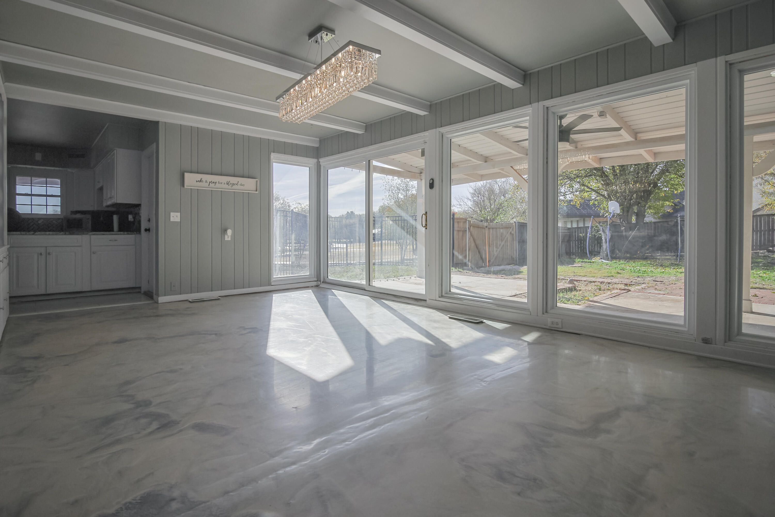 3407 Canyon Road Lubbock, TX 79403 - Photo 5 of 37 a view of empty room with wooden floor and fan