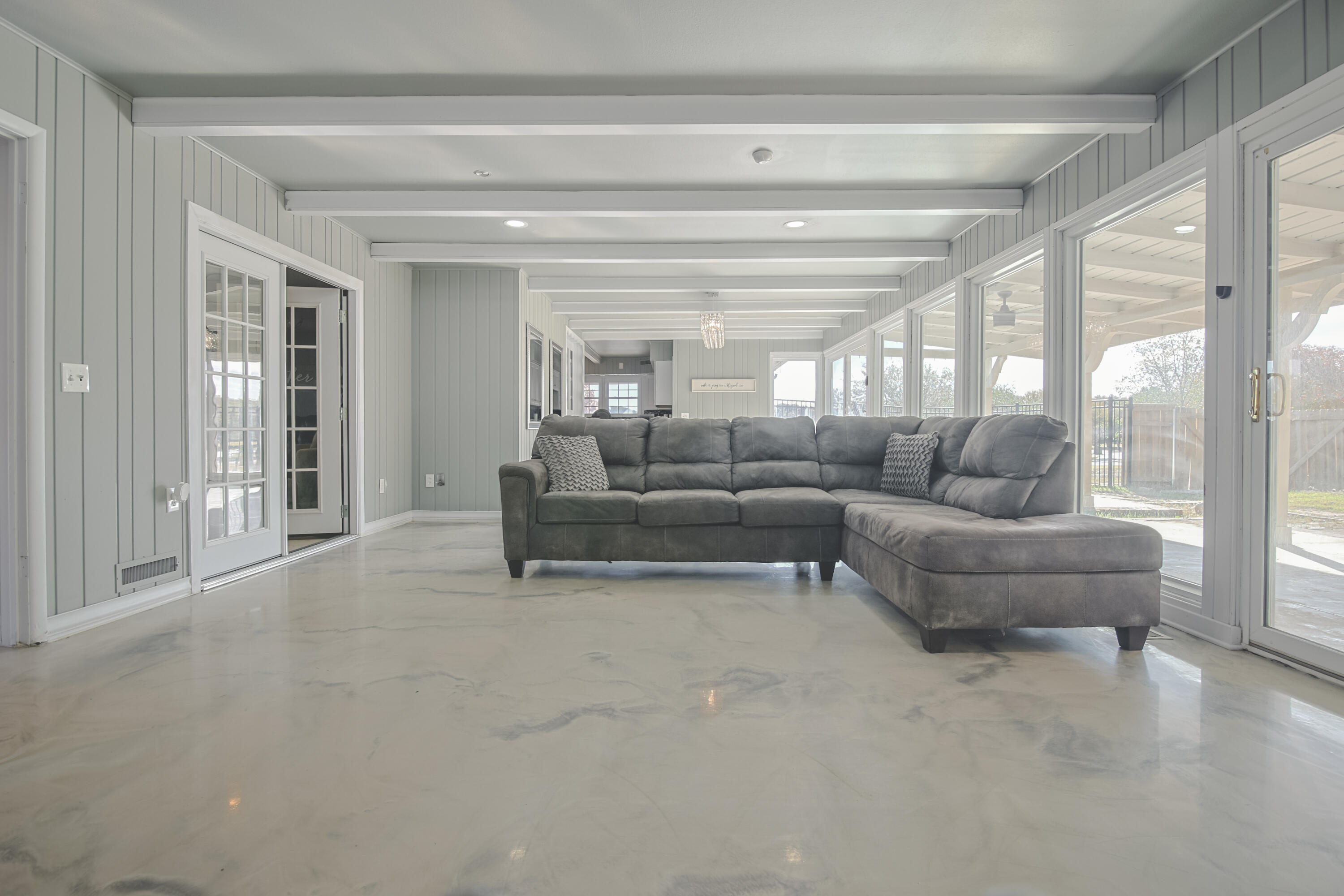 3407 Canyon Road Lubbock, TX 79403 - Photo 8 of 37 a living room with furniture and a large window