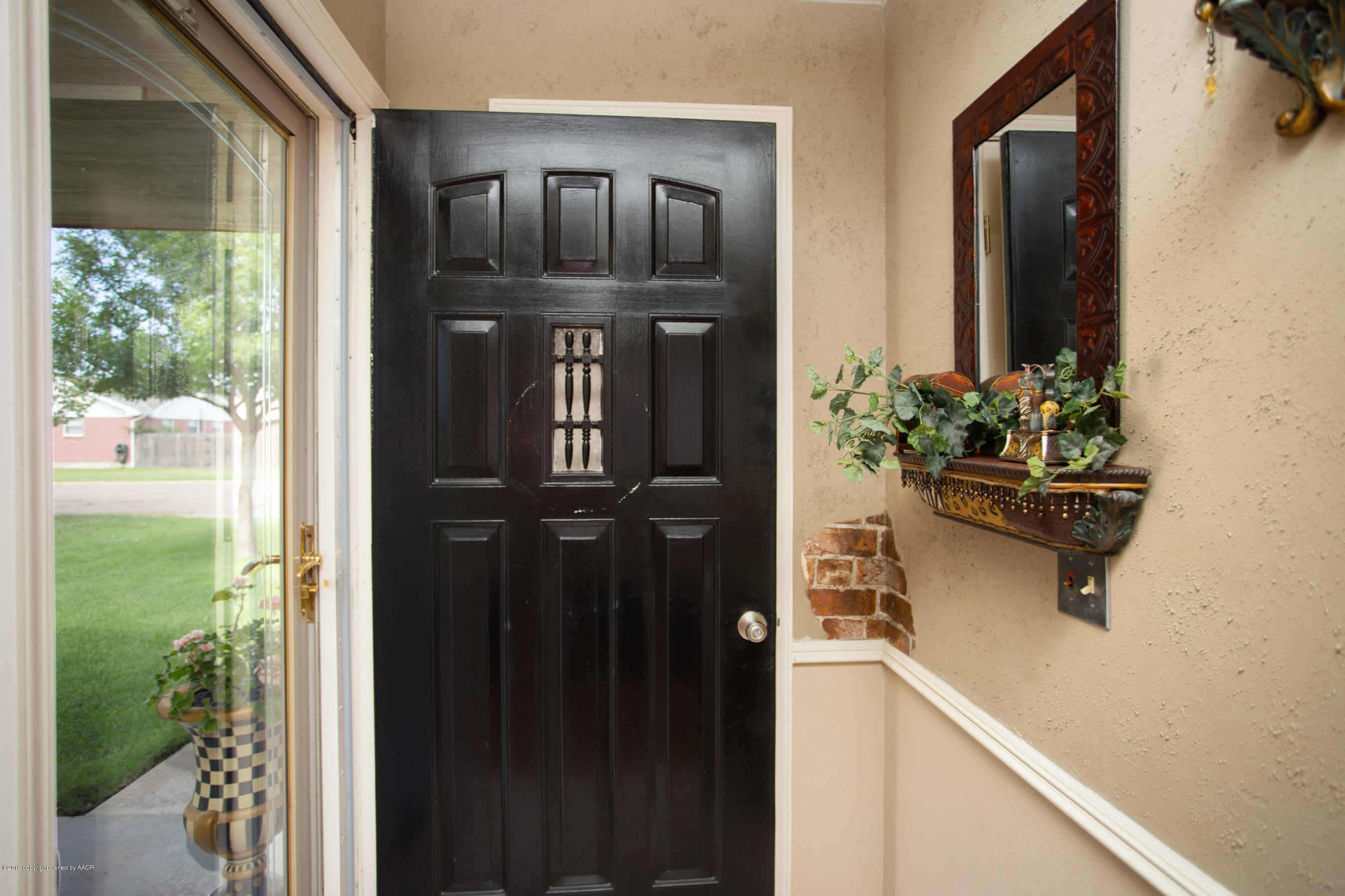 8007 Arbor Street Amarillo, TX 79110 - Photo 4 of 25 a front view of a house with entryway