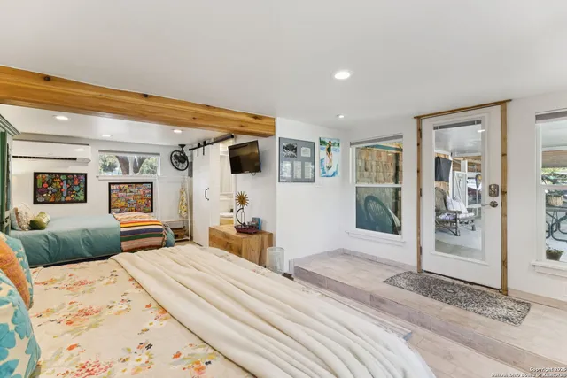 a bedroom with a bed and a dresser