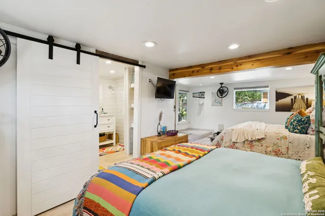 a bedroom with a bed and a table