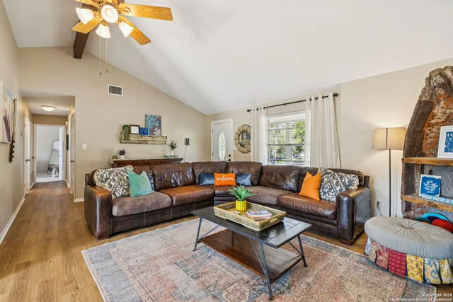 a living room with furniture and a large window