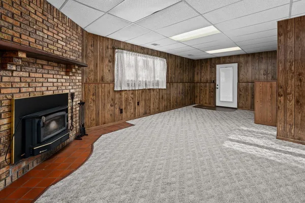 a view of a livingroom with furniture and a fireplace