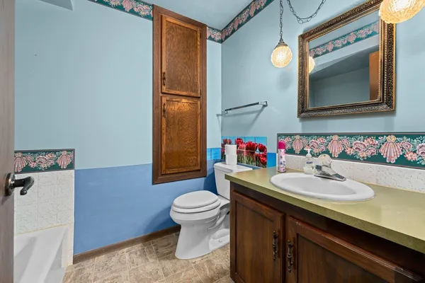 a bathroom with a bathtub and shower