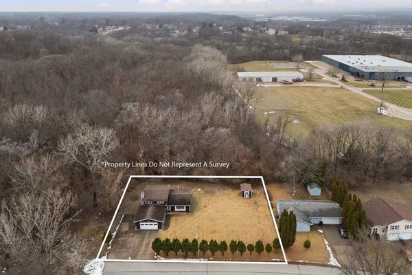 an aerial view of a house with a swimming pool