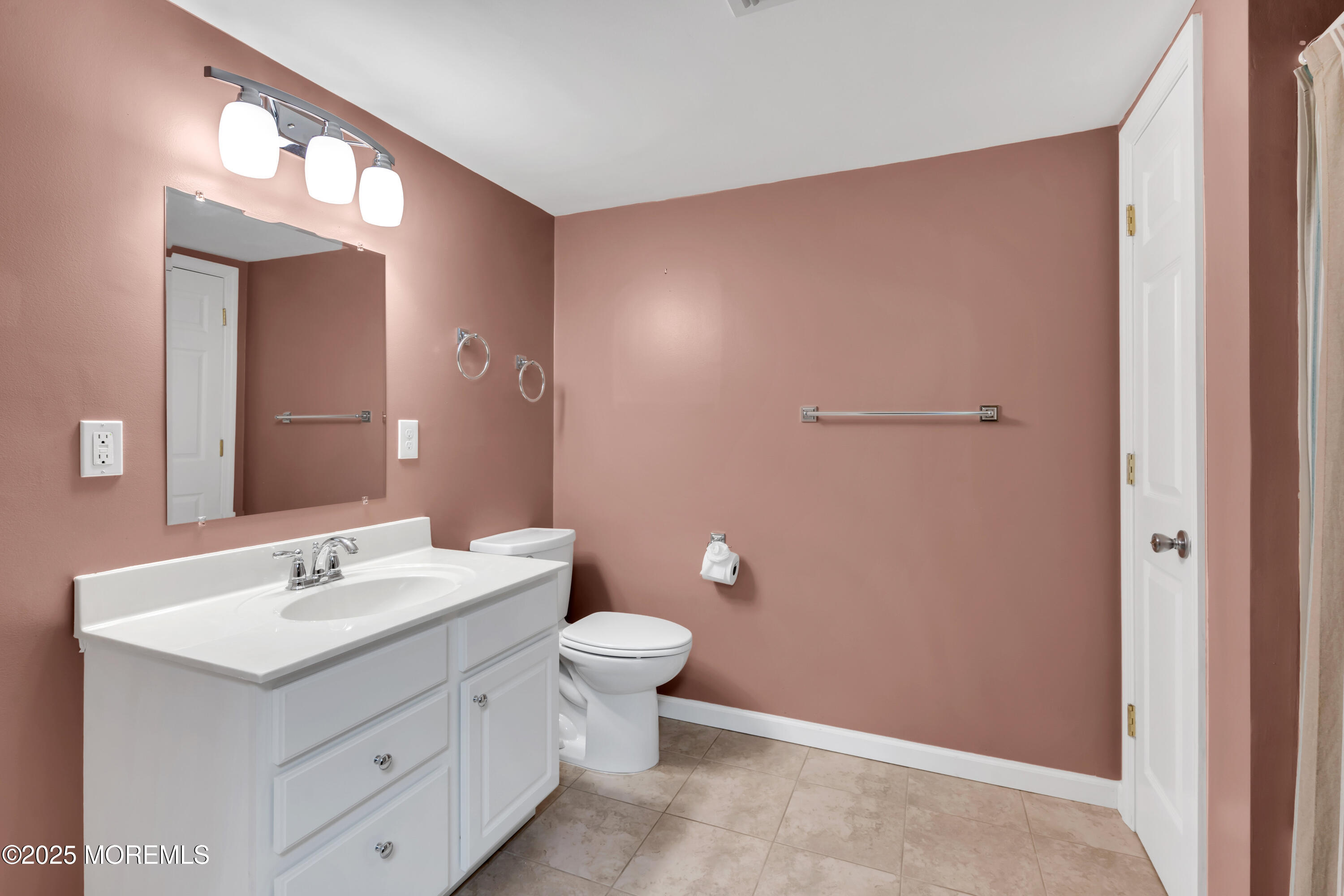 642 Rankin Road Brielle, NJ 08730 - Photo 43 of 59 a bathroom with a toilet sink and mirror