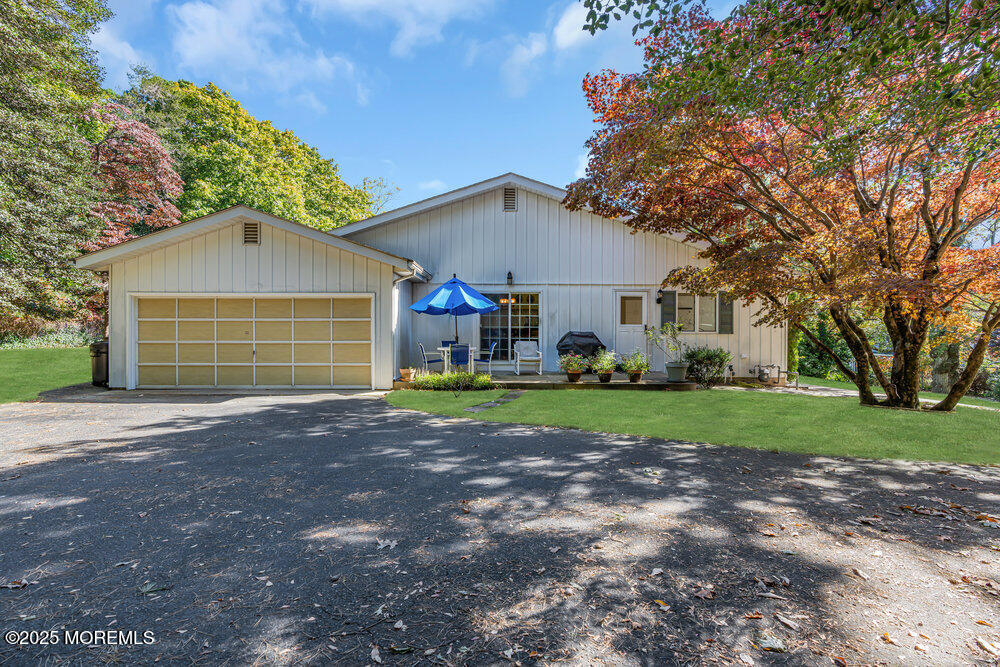 642 Rankin Road Brielle, NJ 08730 - Photo 47 of 59 a view of a house with a yard and large tree